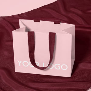 Bolsa de papel de compras de regalo con impresión offset de logotipo de marca de lujo al por mayor con logotipo para ropa bolsa de embalaje personalizada asa de cinta - Product Image 1