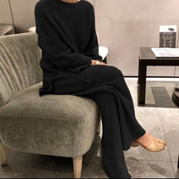 Ensemble tricoté ample personnalisé 2025 printemps nouvelle mode pour les femmes: pull à fente de couleur unie et pantalon à jambes larges ensemble deux pièces