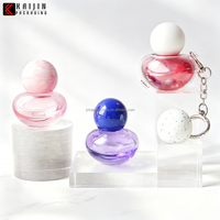 Bouteille de parfum capillaire rose personnalisée de 15ml Bouteille de pulvérisation cosmétique avec pompe et pendentif Bouteille de soin de la peau à bas prix Emballage cosmétique