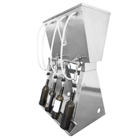 Machine de remplissage par gravité à 4 becs pour vins, spiritueux et jus de fruits dans des bouteilles en verre ou en plastique