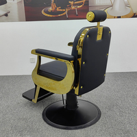 Chaise de salon de coiffure de luxe classique de style antique en cuir noir avec cadre doré et base ronde de haute qualité