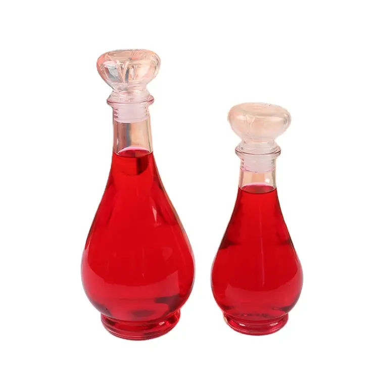 Venta al por mayor de botellas de vino de cristal transparentes decoradas a medida