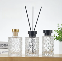 Vase en verre aromatique rond en relief de luxe de 200ml pour bouteille de diffuseur de roseaux dans divers styles pour la décoration de la maison
