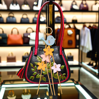 Charme de sac à main en cuir double faces inspiré de fleur d'oiseau personnalisé et accessoires de sac porte-clés de haute qualité