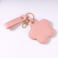 Miroir de maquillage en PU haut de gamme personnalisé européen et américain avec fleur rotative, portable pour voyage, porte-clés.
