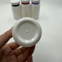 Bouteille en plastique cylindrique blanche PET de haute qualité de 120 ml et 150 ml avec bouchon à vis pour l'emballage de bonbons et de pilules