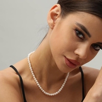 Collier de perles de perles naturelles presque rondes de culture d'eau douce de 6 à 7mm à lustre élevé avec fermoir mousqueton en argent et chaîne d'extension
