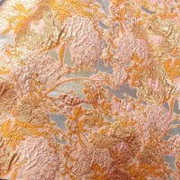 Tissu luxueux en organza jacquard floral et oiseaux, inspiré du style palais, avec fils dorés et découpes ajourées