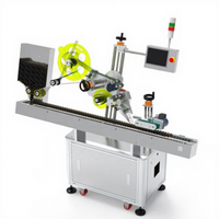 Máquina etiquetadora SKILT para tubo de recolección de sangre de salchicha Máquina etiquetadora de tubos de cilindro pequeño con materiales de alimentación
