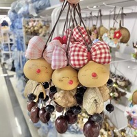 工厂手工制作天然疗愈饰品手工制作的印尼果壳娃娃挂铃种子串袋声音疗法礼物