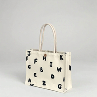 Sac fourre-tout en toile d'herbe de lettre aléatoire en gros, réutilisable en usine avec boutons cachés pour un usage quotidien et des cadeaux personnalisés