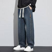 Pantalon en denim brodé à imprimé léopard vert fluorescent pour hommes de High Street Design à jambe droite robuste à la mode avec des techniques lavées