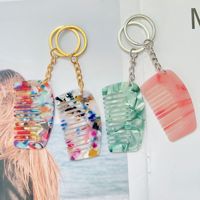 Vente en gros d'usine, modèles variés, logo personnalisé, mini peigne porte-clés portable en acétate pour cheveux