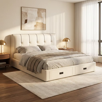 Lit capitonné en cuir véritable blanc crème moderne de luxe avec tiroirs de rangement à vérins hydrauliques et tête de lit capitonnée, taille King
