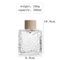 Bouteille diffuseur d'arômes en verre transparent carré de qualité supérieure OEM 50ml 100ml 200ml avec texture martelée, bouteille vide pour usage domestique