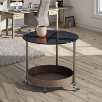 Table basse moderne en verre trempé avec pieds en métal |   Table basse ronde à roulettes avec système de poussée et de traction