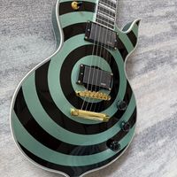 Guitare électrique Odin Zakk avec corps en acajou, style anneau noir-vert, micros intégrés, accastillage doré, extrémités de frettes, jeu fluide