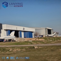 Hangar Prefabricado de Acero para Aviones en Argentina, con Sistema de Techo de Alta Resistencia para Operaciones de Servicio Aéreo