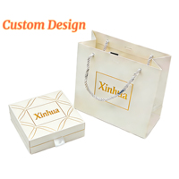 Boîte à bijoux rigide de luxe moderne en carton ondulé avec doublure en éponge, finition mate et UV pour logo personnalisé, idéale pour boucles d'oreilles