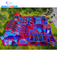 Glissière géante d'île d'aventure gonflable bleu rouge d'enfants nouvellement populaires + parc à thème gonflable de service d'OEM de piscine à balles