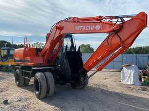 Excavatrice sur pneus hydraulique HITACHI EX100WD d'occasion, 10 tonnes, moteur modèle 2022, boîte de vitesses, pompe, moteur, capacité de la benne de 0,4 m, puissance de 55 kW - Product Image 2