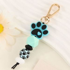 Silicone Cat Paw Beaded <b>Keychain</b> Fluffy Pom-Pom Wood Beads Handcrafted Light Keyring Accessory with Woven Technique - Product Image 1
