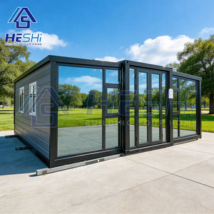Bureau moderne en conteneur HESHi, structure préfabriquée rectangulaire extensible avec murs en verre et cadre noir - Product Image 1