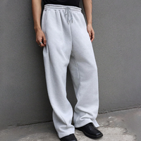 Pantalon de jogging ample pour homme, coupe décontractée, jambe large, taille élastique avec cordon de serrage, poches, bas ouvert, style athlétique
