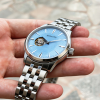 Montre automatique mécanique pour homme en acier inoxydable avec verre saphir, cadran bleu glacé texturé, fenêtre squelette partielle, style affaires