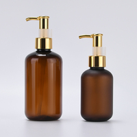 Bouteille de pompe vide de luxe en plastique PET ambré 120ml 250ml 500ml givré sérigraphiée en soie couvercle d'huile en or logo personnalisé shampooing cheveux