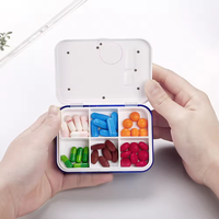 Minuterie intelligente personnalisée Mini boîte à médicaments portable Conteneur à pilules électronique Rappel de réveil à écran numérique en plastique durable