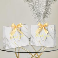 Sac en carton de luxe pour emballage de boutique Conception en marbre «Merci» Sac en papier cadeau Stratification Gaufrage Écran Ruban de coton