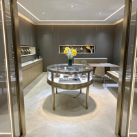 Présentoir de bijoux en or et diamant moderne de luxe Table ronde en acier inoxydable pour vitrine avec lumière LED