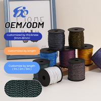 Cordon en polypropylène tressé 8 brins, fil doré 4 mm sur bobine noire, idéal pour emballages cadeaux et cordons de vêtements