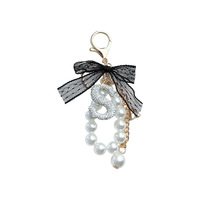 Porte-clés créatif en alliage de zinc avec perles et strass, pendentif de sac, nœud en dentelle tendance, style coréen, avec lettre