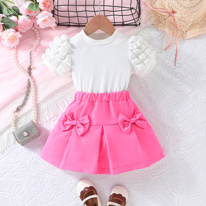 Ensemble Deux Pièces T-shirt à Manches Bulles et Jupe Courte à Nœud Couleur Unie pour Filles – Vente en Gros - Product Image 2