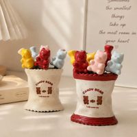 Keramische fruitvorkhouder in schattige beer-vorm (set inbegrepen) met spiegelafwerking; stijlvolle houder voor dessertvorkjes en fruit.