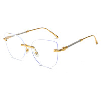Lunettes de vue photochromiques anti-lumière bleue WENDUO œil de chat, monture sans bords en métal doré, verres à bords taillés en diamant pour femmes