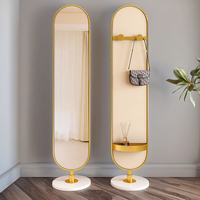 Miroir de dressing multifonctionnel rotatif moderne en métal pour chambre à coucher Miroir sur pied avec porte-manteau et porte-chapeau Miroir décoratif