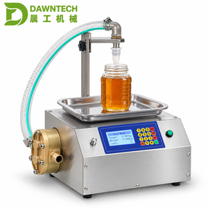 Machine de remplissage automatique de liquides par pesage pour le miel, la pâte de sésame, la crème, le beurre, les jus, les boissons et les liquides visqueux - Product Image 1