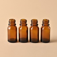 Bouteille en verre Transparent épaissie brune résistante à la lumière embout en plastique estampé à chaud compte-gouttes pour huile essentielle goutte pour les yeux