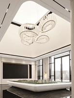 Lustre LED moderne abstrait circulaire en acrylique et métal, idéal pour les halls d'hôtel, les bureaux de vente, les atriums et les réceptions de clubs