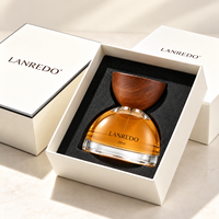 Vente en gros de flacons de parfum en verre transparent semi-circulaires vides de 30 ml, 50 ml et 100 ml, conformes à la réglementation REACH, avec bouchon en bois et boîte cadeau en papier