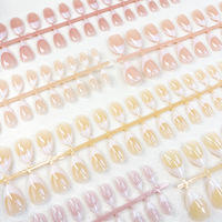 Faux ongles courts à presser, forme French demi-lune œil de chat, couleur unie nude poudré, effet illuminateur, chic, vente en gros, ongles finis