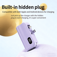 Mini Power Bank 5000 mAh avec affichage numérique, support de téléphone 3-en-1, double tête et câble intégré, format capsule