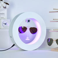 Expositor Magnético Flotante de Acrílico para Gafas en Forma Redonda Blanca, Soporte Levitante y Giratorio para Lentes de Sol y Publicidad
