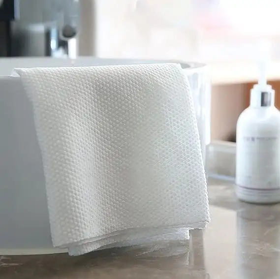 Vente en gros de serviette de visage et de bain jetables en fibre végétale écologique à forte absorption de qualité Serviette de bain jetable