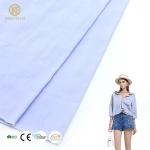 Factory cheap price 100% cotton woven solid color soft light weight jacquard fabric for girls dress shirt