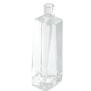 Wholesales tall trapezoid glassbottles 750ml 700ml with a round bulge on bottles for liquor rum whisky ginvodka beverage water