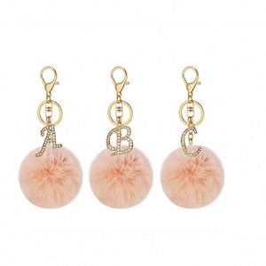 Llavero DIY de 26 letras inglesas con diamantes brillantes, bola de pelo de conejo, llavero de felpa con cristal, llavero de metal para bolso, regalo de joyería al por mayor - Product Image 3